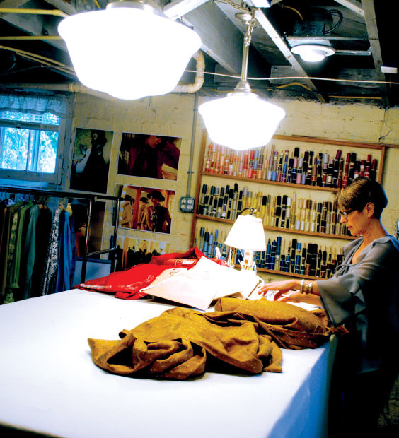 In the basement where Rath creates and sews, music bounces softly off the cool, stone walls of her workspace.